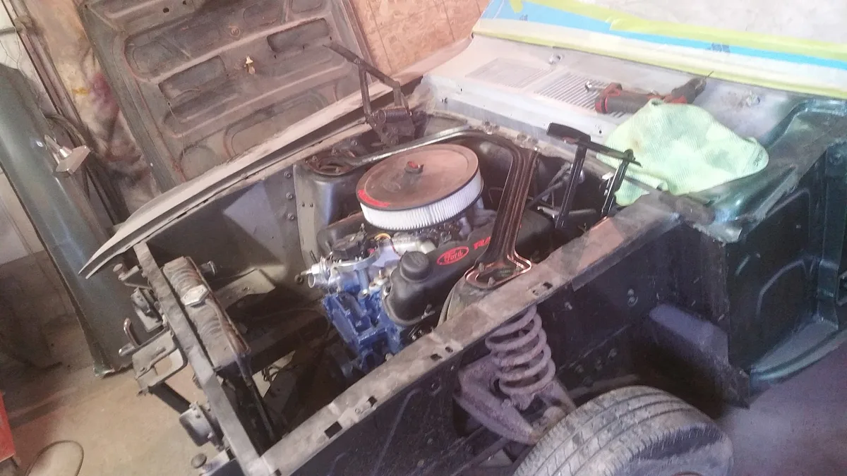 Engine bay mid-job at Larry's Auto Works